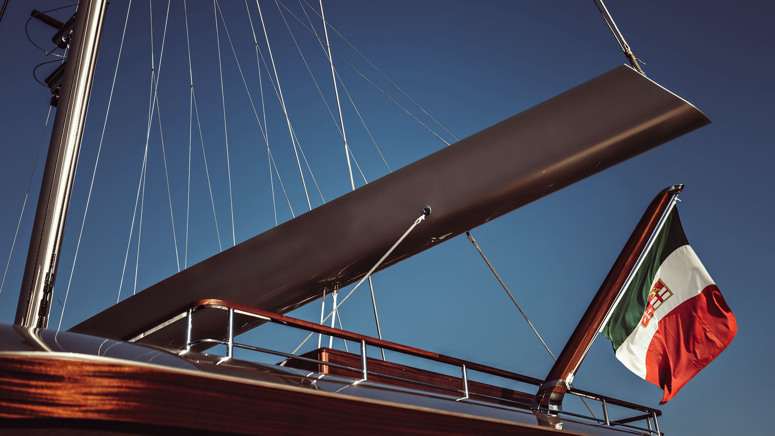 View of mast from below and Italian flag