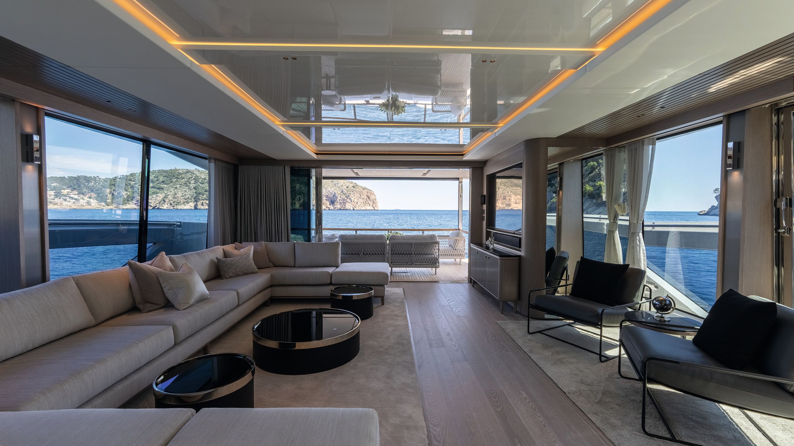 Alternative view of the main deck showing doors that open out at the front to soft seating in the sun