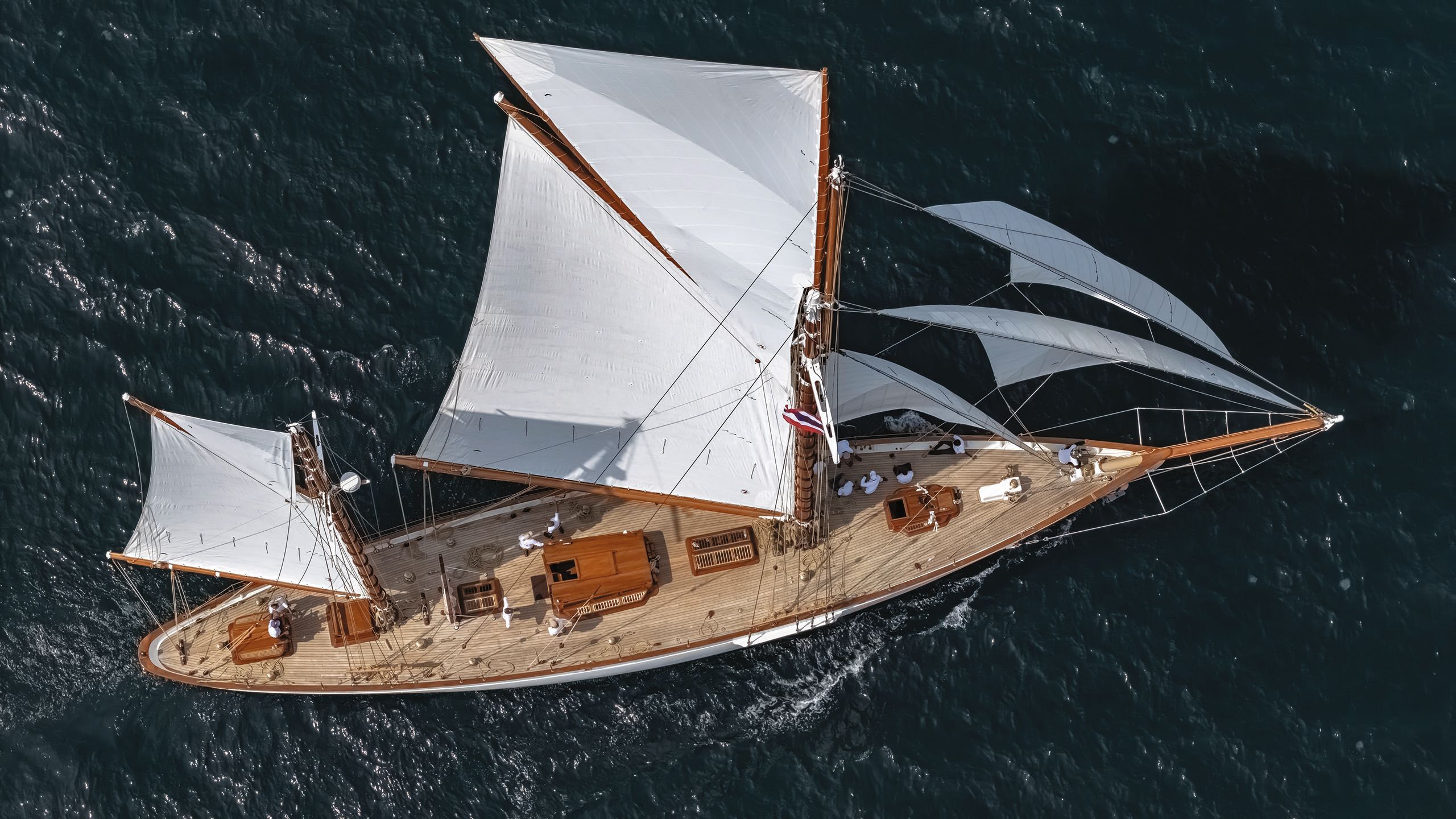 Cariad from above with its sails out on the water