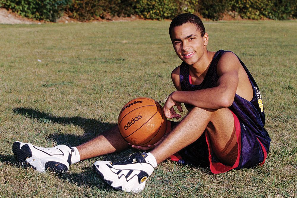 Parker aged 15 holding basketball
