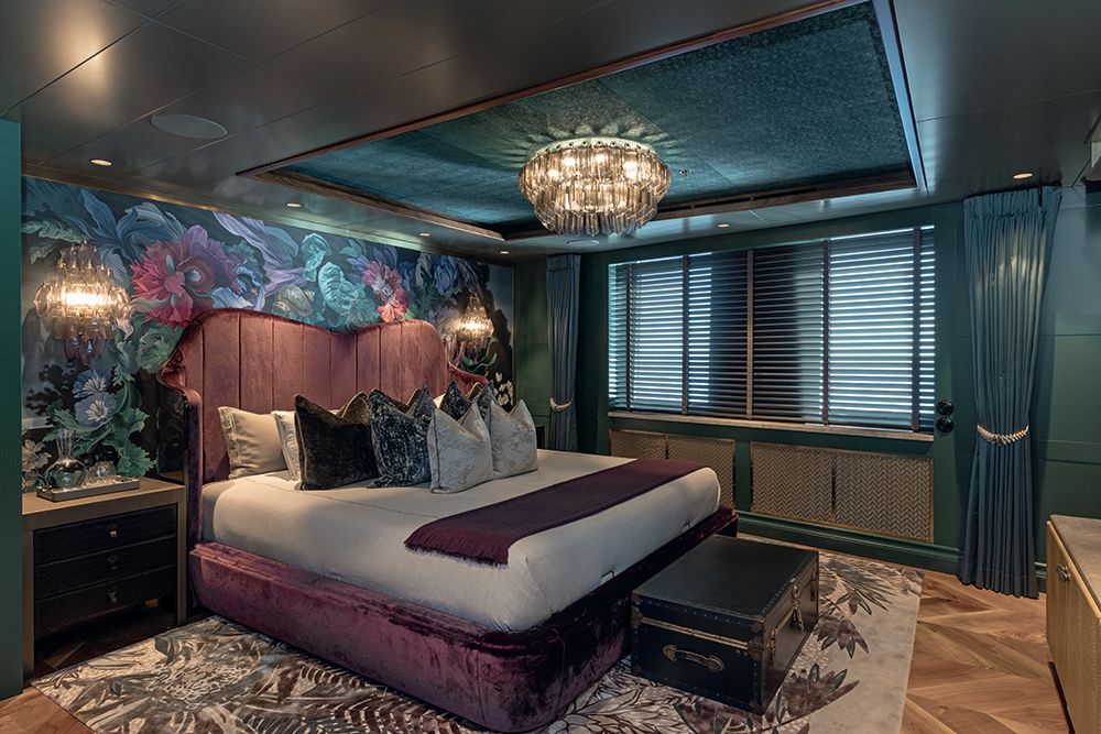 Bedroom with wallpaper and bespoke headboard