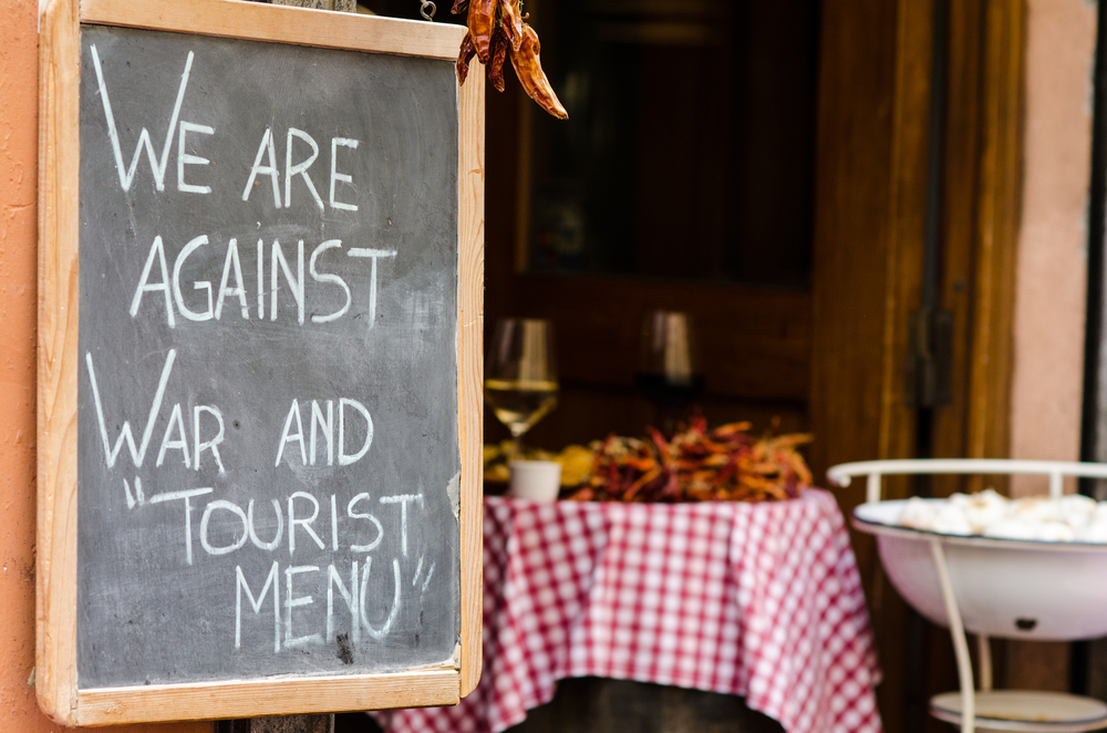 A sign outside of a restaurant in Rome