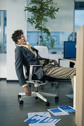Who should have an office chair with a solid back?