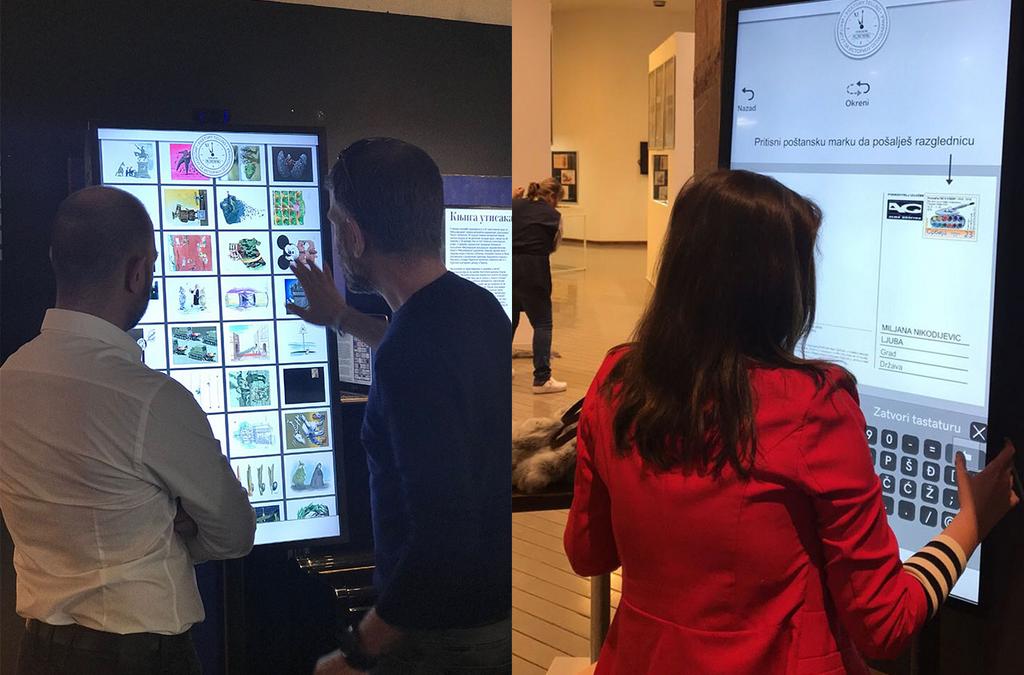 Visitors at the National Library in Belgrade interact with a multi-touch screen displaying a variety of postcards.