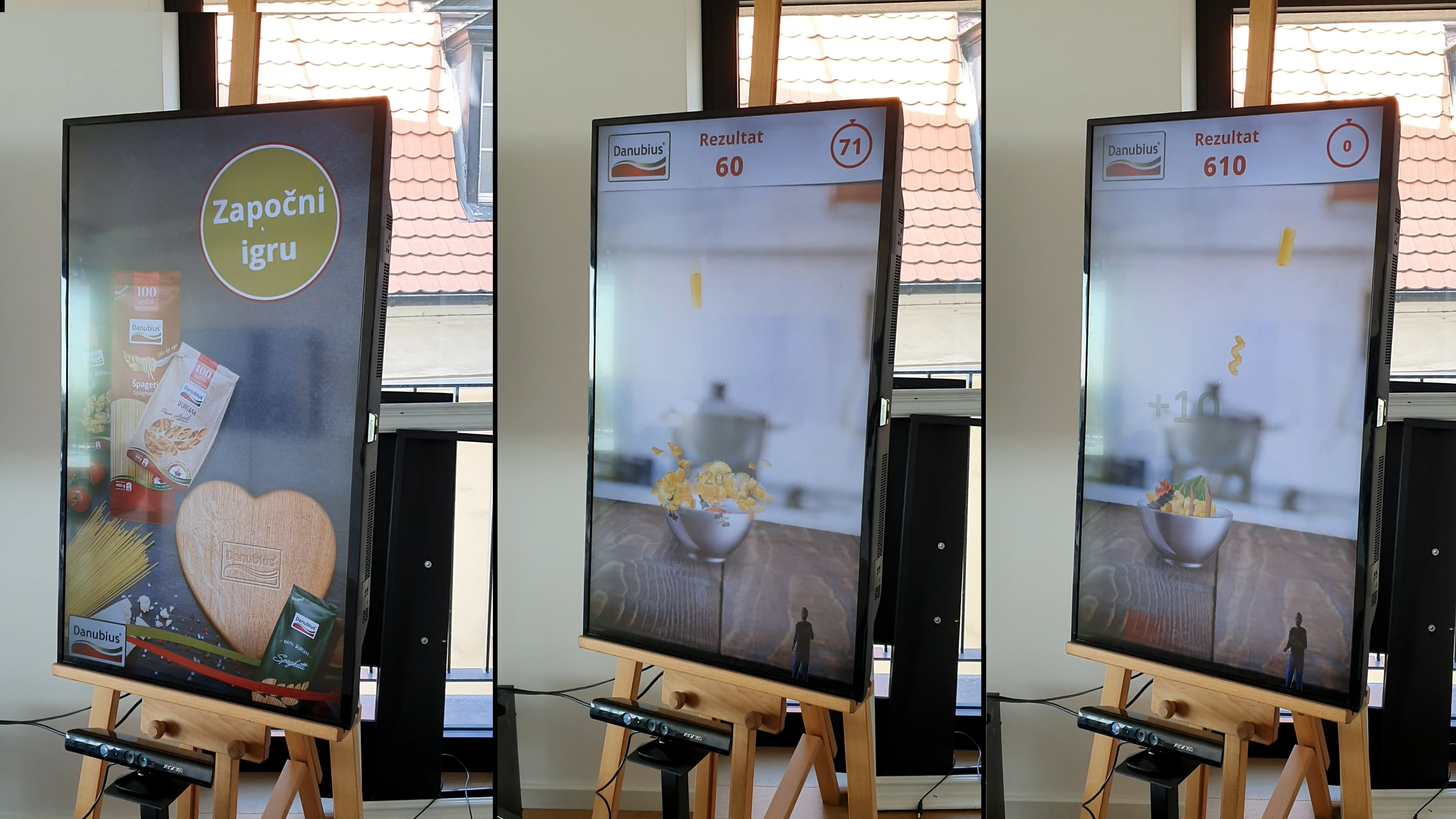 A trio of interactive displays from the Delta KINECT Experiences, featuring motion-controlled games set up in a shopping mall. 