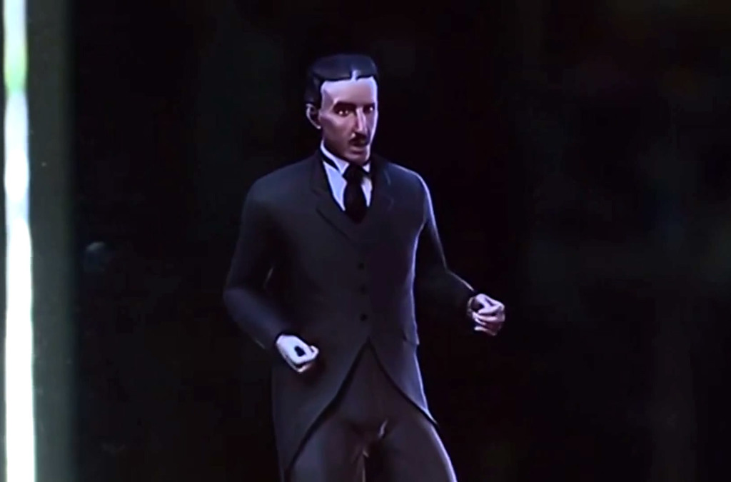 : A close-up of the holographic projection inside the display case showing a lifelike representation of Nikola Tesla in period clothing, appearing to speak. 