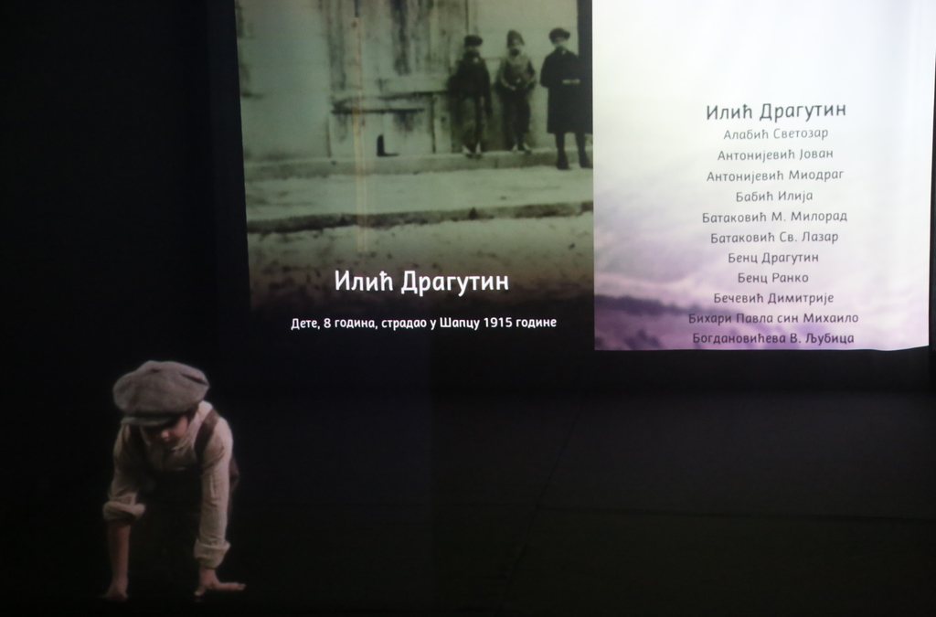 A life-sized hologram of a WWI victim, displayed alongside historical context and a list of names.