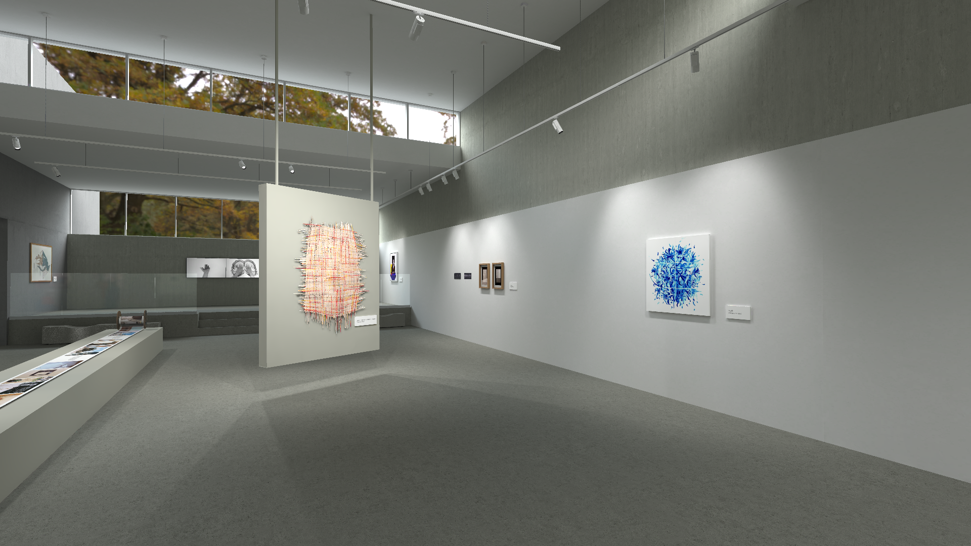 A series of images showing different perspectives of a contemporary art gallery. The gallery has a minimalist design with concrete benches, large windows revealing autumnal trees, and a variety of modern artworks including sculptures and framed pieces. The lighting is provided by track lights on the ceiling, creating a bright and airy atmosphere.