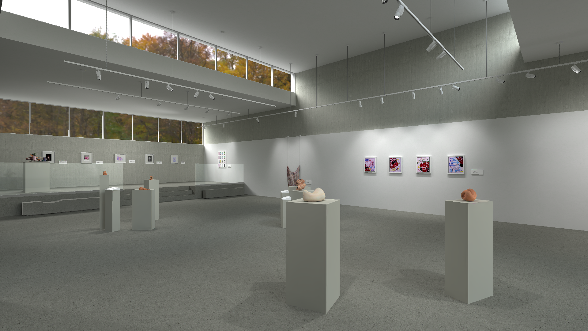 Spacious art gallery featuring sculptures displayed on pedestals and a series of colorful, framed artworks on the walls. Large windows at the top of the walls let in natural light, highlighting the autumn foliage outside, complementing the indoor lighting from the ceiling tracks.