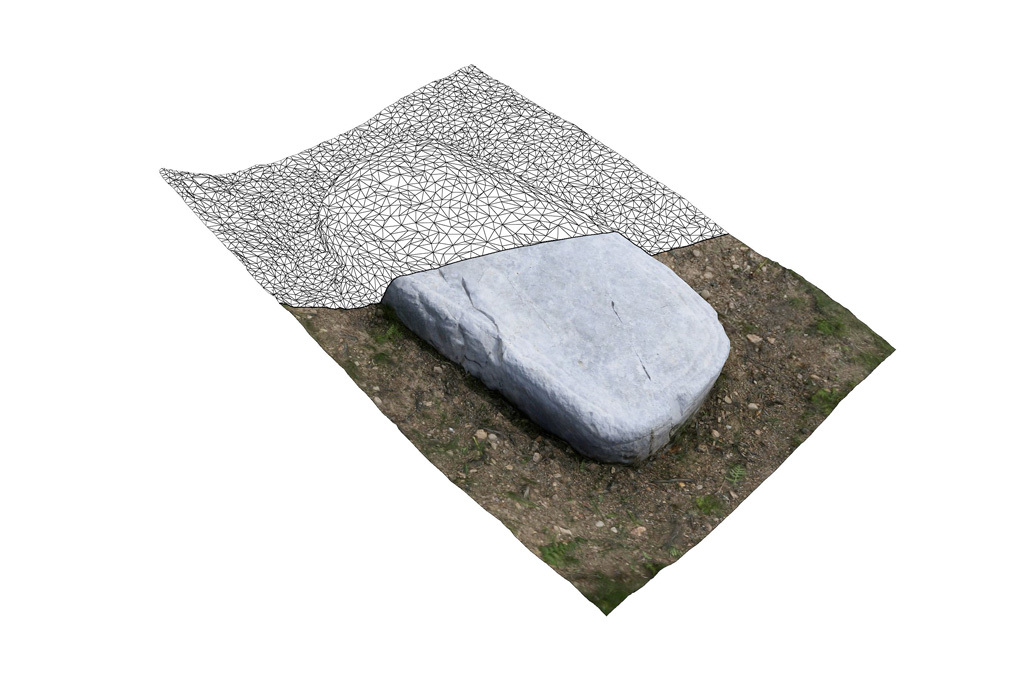 Digitally rendered ancient tombstone from a cemetery, featuring a smooth surface with slight indentations and a grassy base, juxtaposed with a wireframe mesh.