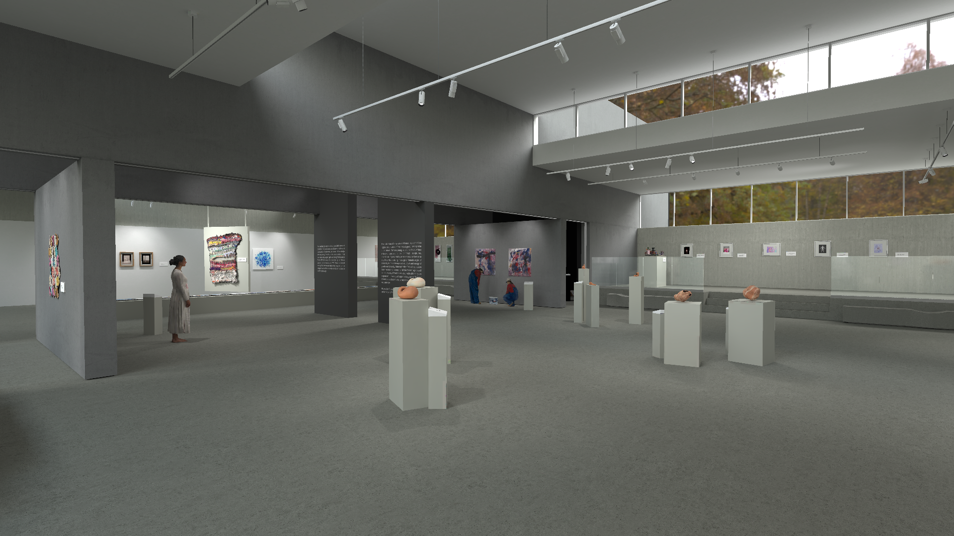 Spacious art gallery featuring sculptures displayed on pedestals and a series of colorful, framed artworks on the walls. Large windows at the top of the walls let in natural light, highlighting the autumn foliage outside, complementing the indoor lighting from the ceiling tracks.