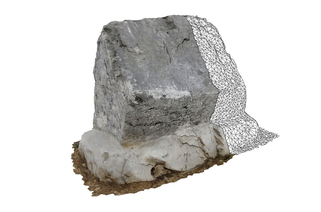 3D scanned image of a standing ancient tombstone showing detailed textures and natural weathering, with a wireframe mesh on one side.