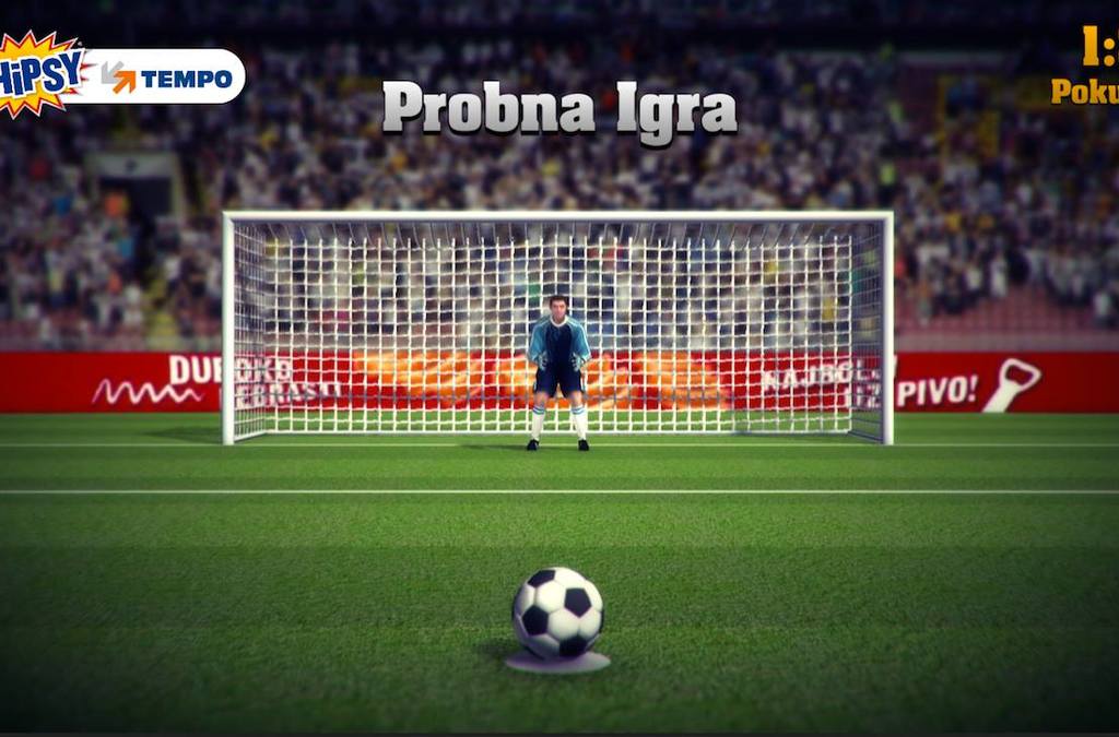 A screen displaying a virtual soccer goal and goalkeeper, inviting customers to take a penalty kick in an interactive promotional campaign at a retail location.