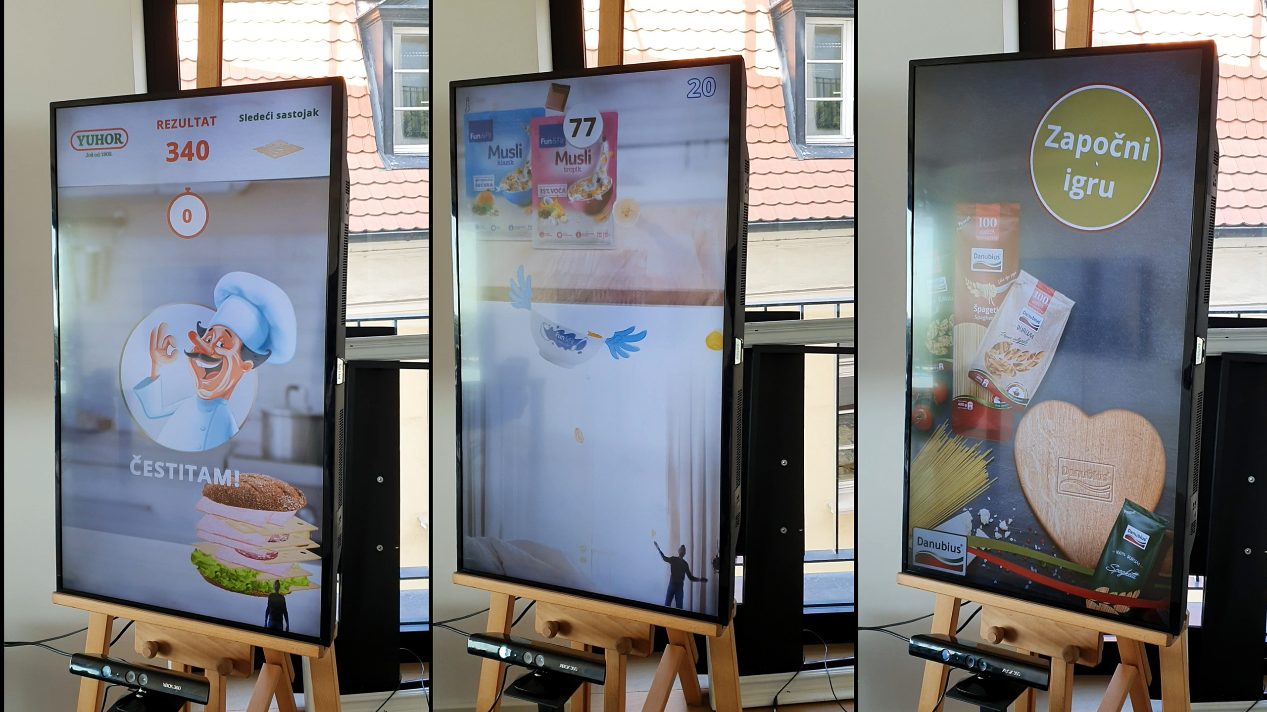 A trio of interactive displays from the Delta KINECT Experiences, featuring motion-controlled games set up in a shopping mall.