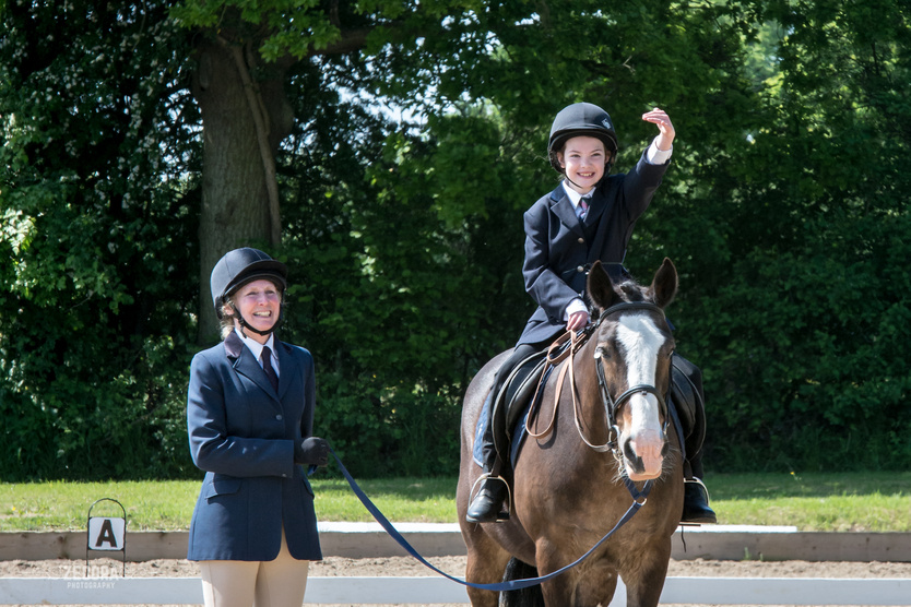 Sophie Burrow, riding Bisto from Bradbourne Group salutes the judge at the end of her test