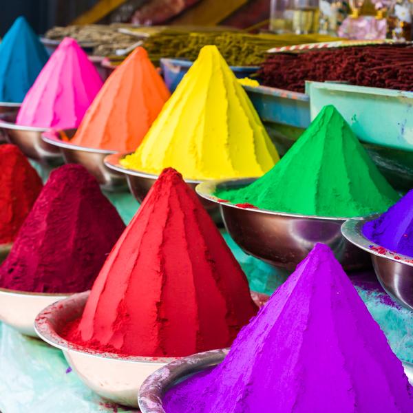 Bowls of vibrant colored dyes in India - holi colors.