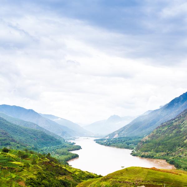 Green hills flank an early stretch of the Yangtze River