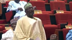 Covid-19-Moment-Nigerian-lawmaker-removed-his-mask-to-sneeze