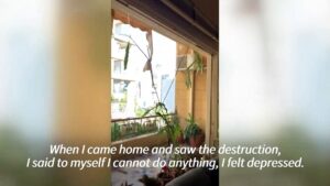 Elderly-woman-finds-solace-in-music-amidst-destruction