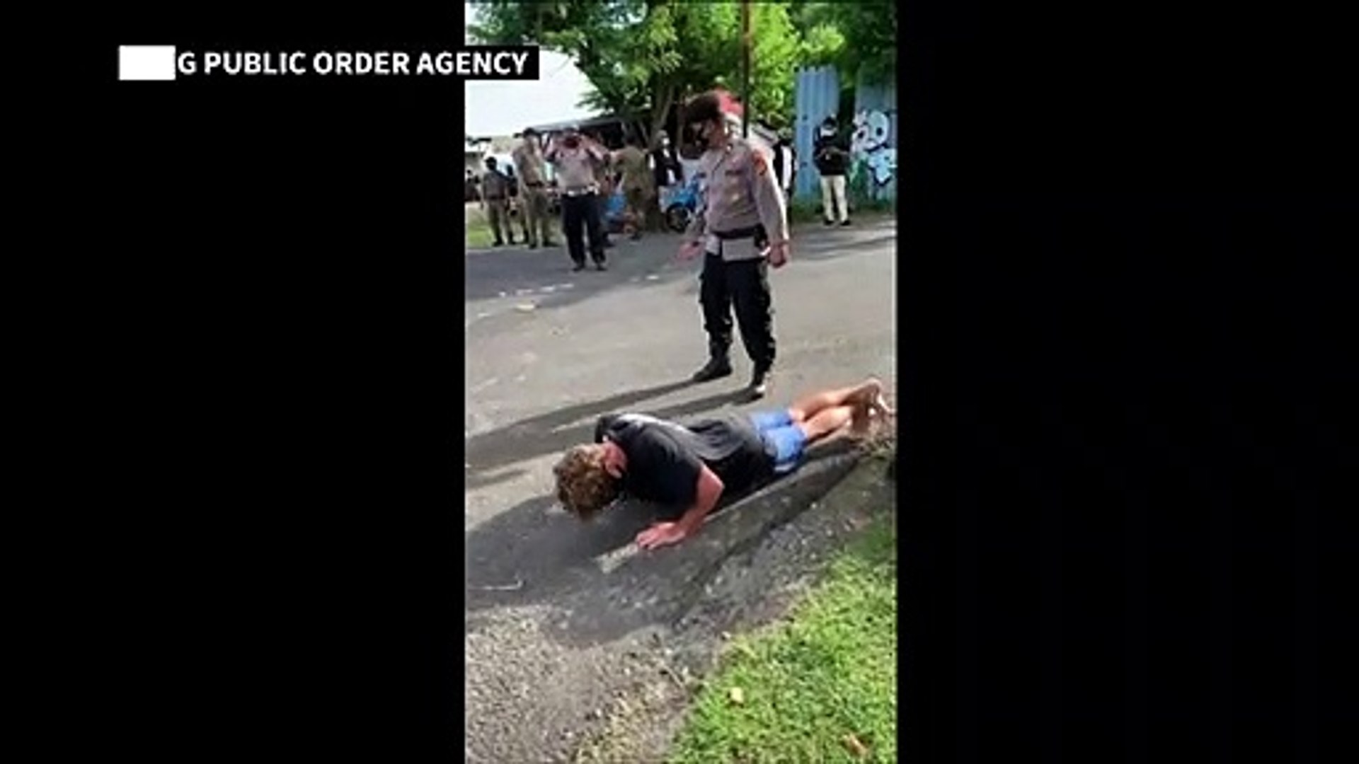 Foreigners-without-face-masks-punished-with-push-ups-in-Bali