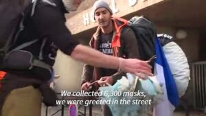 Franco-British-pair-walk-length-of-France-cleaning-mask-pollution