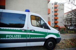 A police car is pictured outside the house of a Syrian man suspected of exchanging bomb building material that was arrested earlier today in Berlin