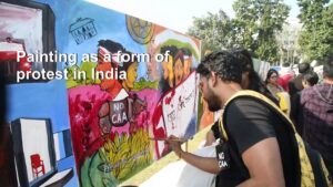 Indian-protesters-paint-angry-messages-against-new-law