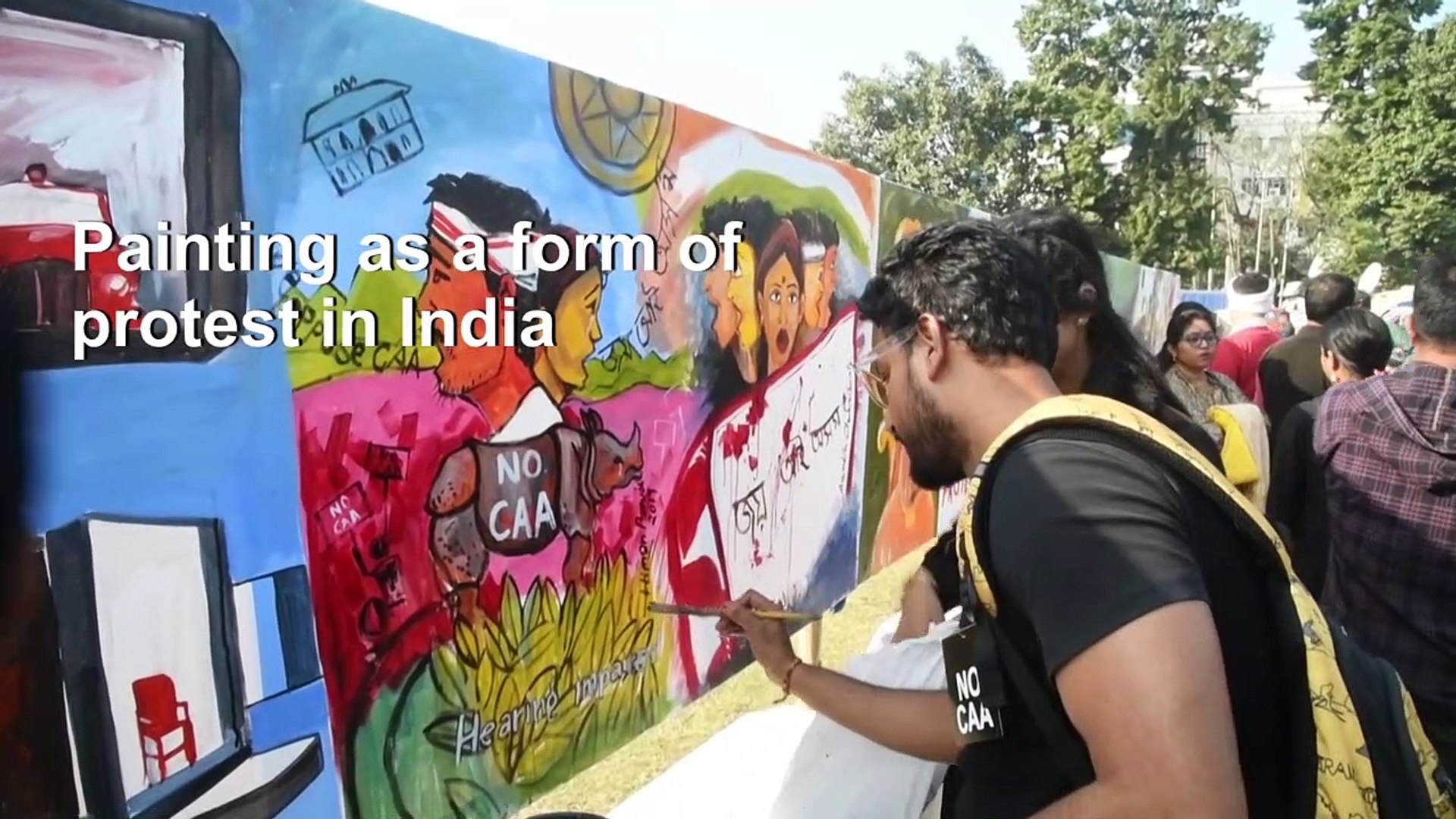 Indian-protesters-paint-angry-messages-against-new-law
