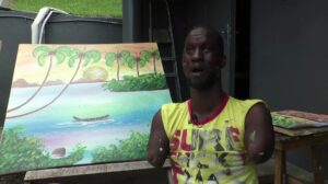 Ivorian-painter-with-no-arms-or-legs-inspires-many