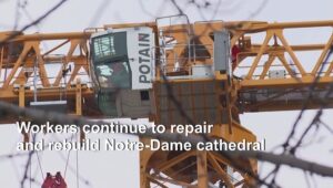 No-Christmas-Mass-at-Notre-Dame-but-topped-by-a-giant-crane