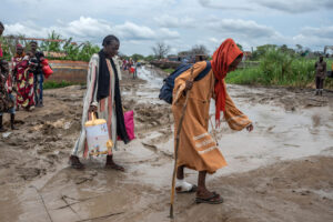 Refugees that fled fighting in Sudan head towards a barge in Renk, South Sudan before being relocated to their place of origin, on Aug. 27, 2023. (Joao Silva/The New York Times)