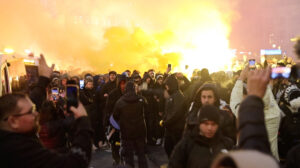 Israeli Maccabi Tel Aviv supporters demonstrate and light flares in Amsterdam