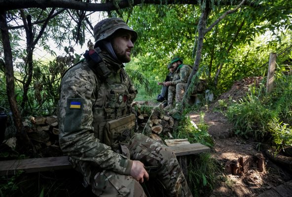 Ukrainian service members are seen on their position at a front line in Donetsk region