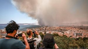 Wildfires rage in France, Serbia