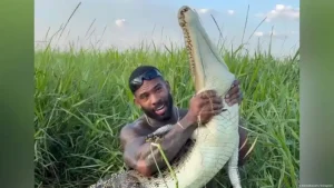 Crocodile wrestling influencer flaunts wildlife rules
