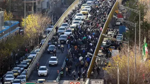 Protesters in Iran clash with security forces