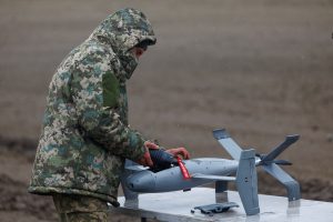 Ukrainian serviceman installs a warhead into an interceptor drone, a part of MEROPS system, during a training in an undisclosed location in Ukraine