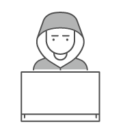 A person in a hoodie sitting in front of a laptop