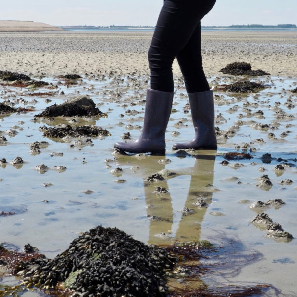 Laarzen op de zandbodem