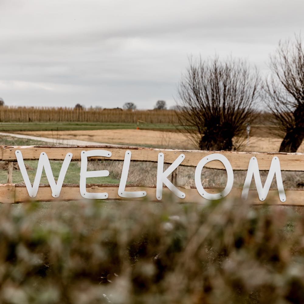 Houten letters welkom