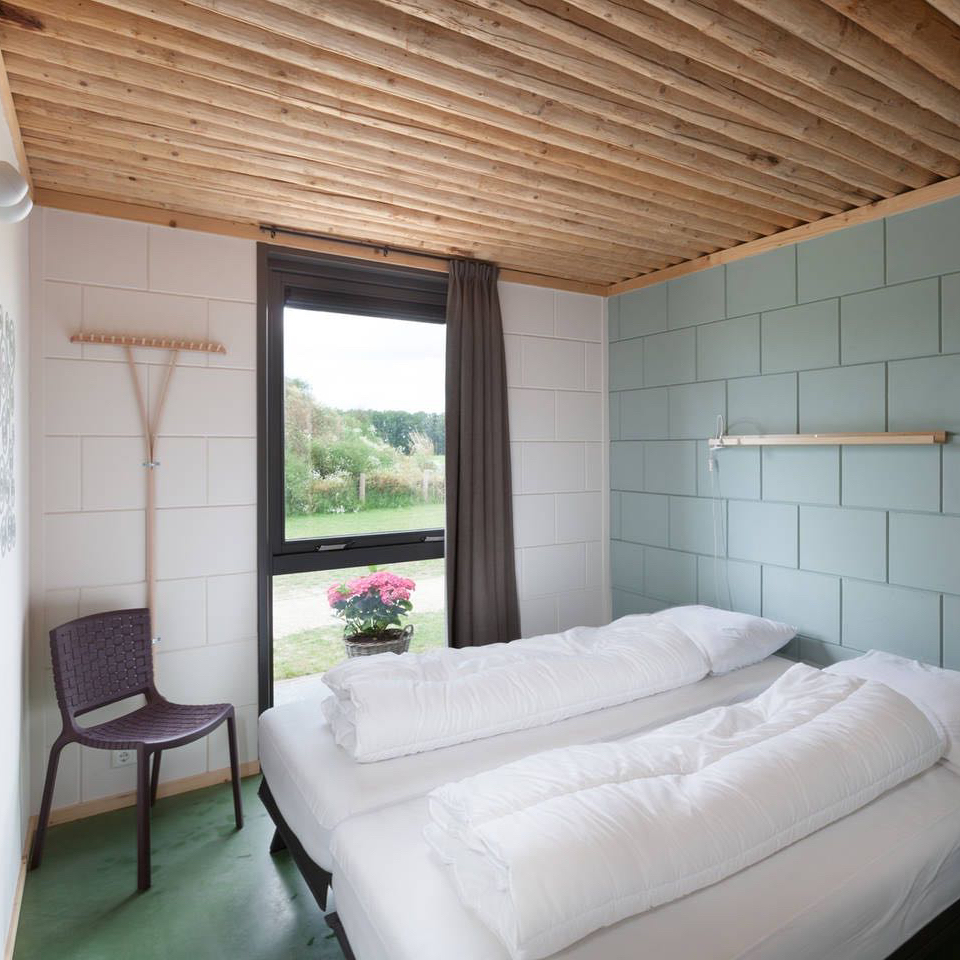 Slaapkamer in het vakantiehuis op de boerderij