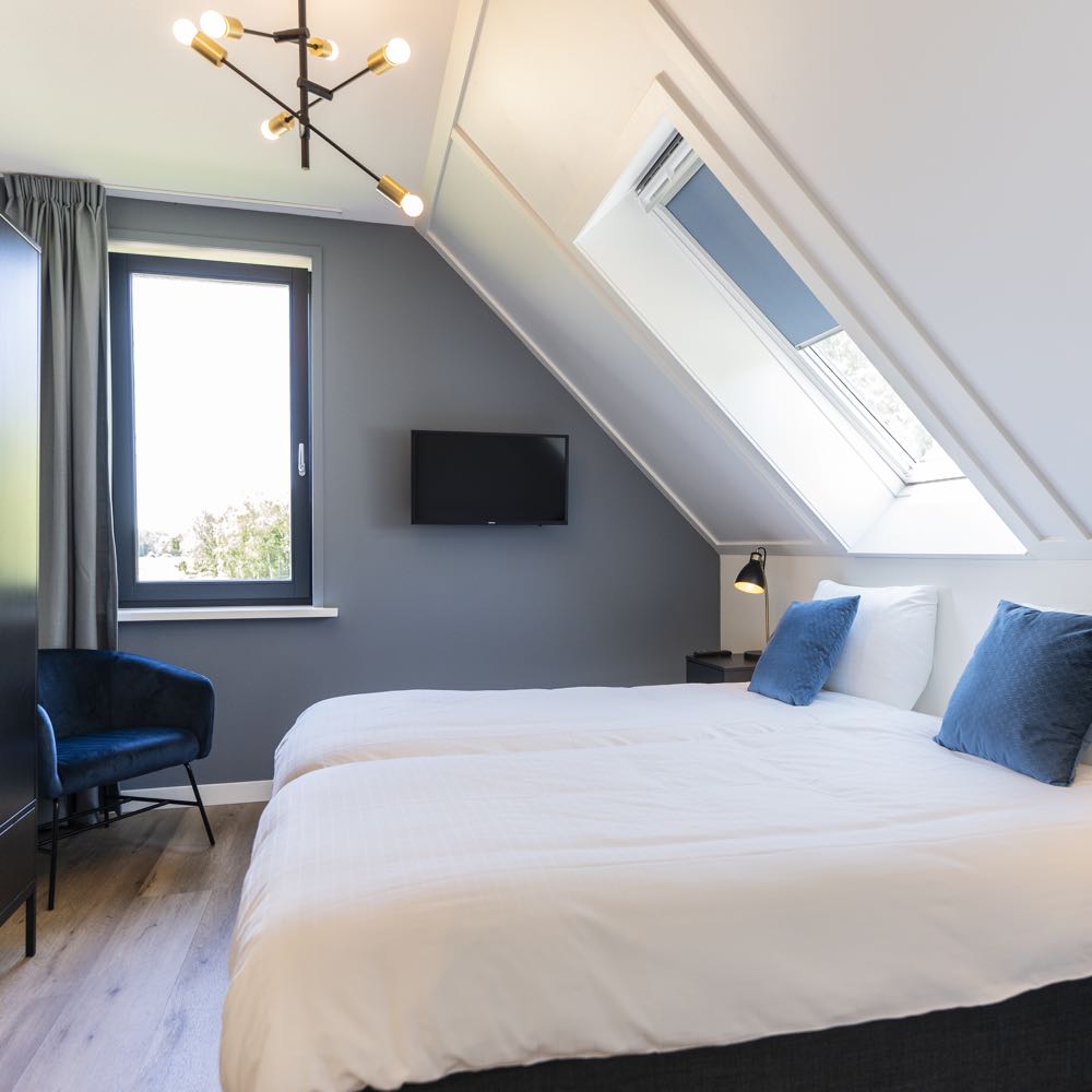Een van de slaapkamers groepsaccommodatie Texel