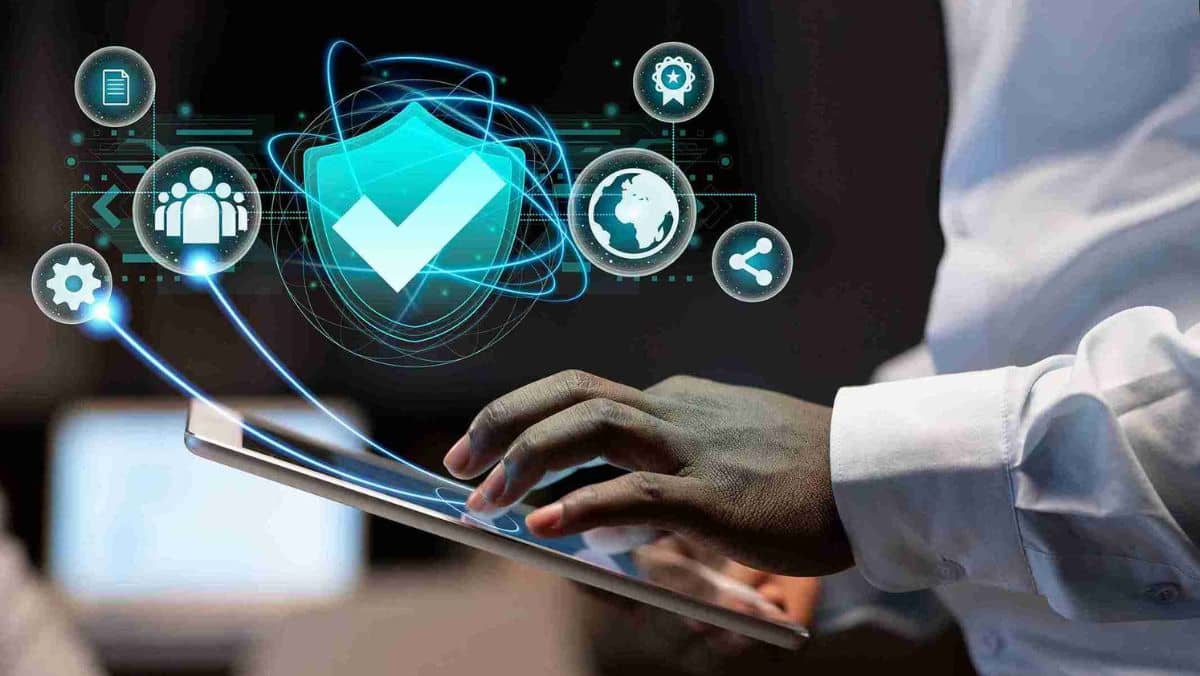 A man holding a tablet showing icons of security networks about cryptocurrency