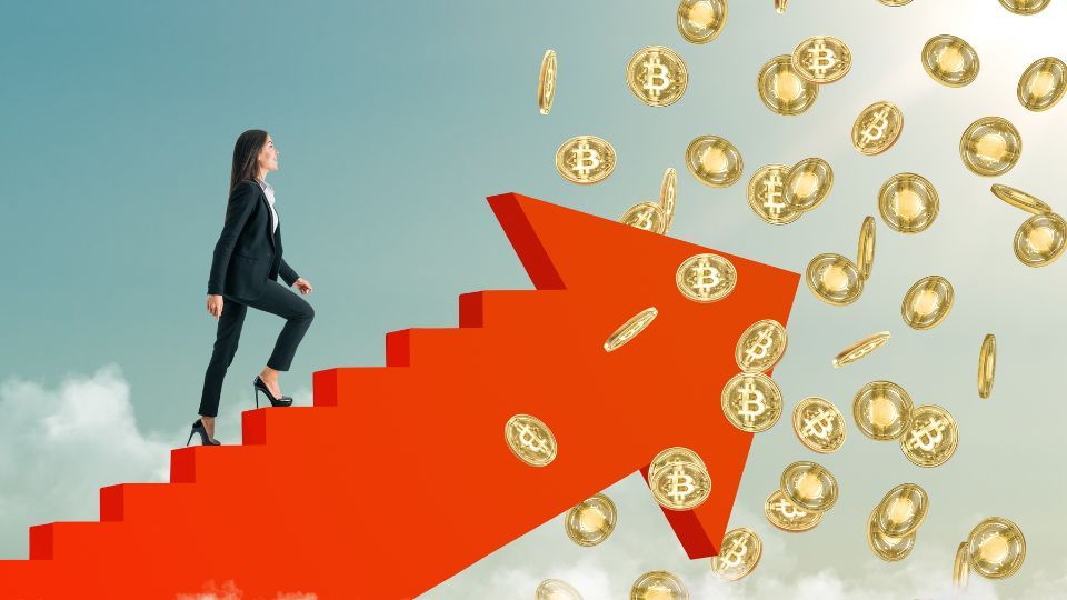 A woman in a business suit climbing a red arrow staircase with Bitcoin coins raining down against a sky background