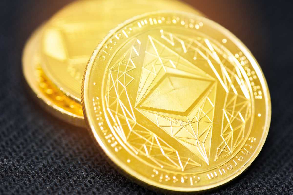 Close-up of Ethereum coins with a detailed emblem on a dark background
