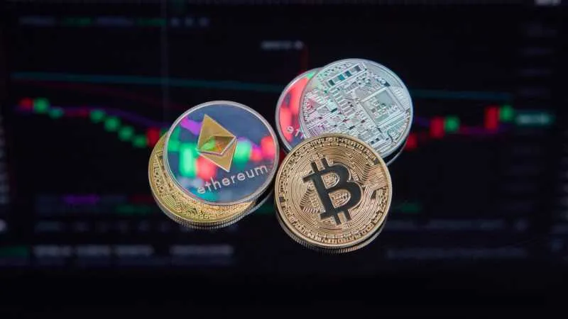 Ethereum and Bitcoin coins against a trading chart background