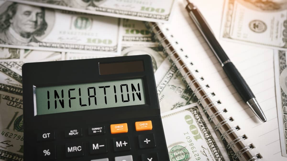 INFLATION word on calculator in idea for FED consider interest rate hike, world economics and inflation control, US dollar inflation.