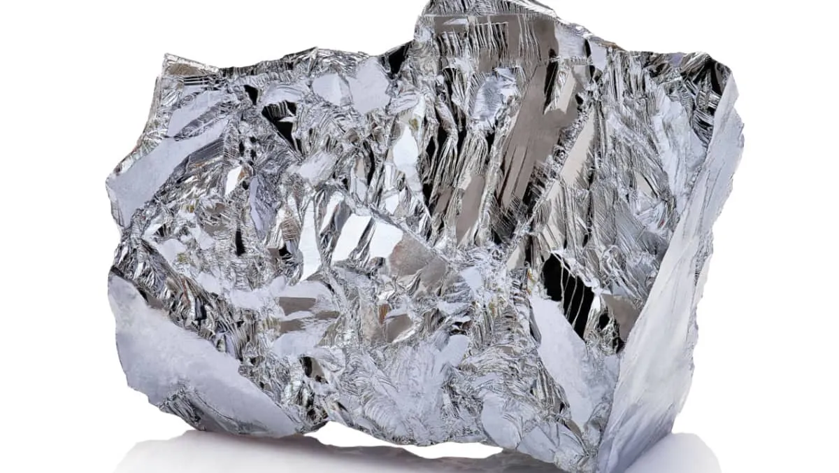 Macro shoot of a piece of nickel metal ore isolated on a white background