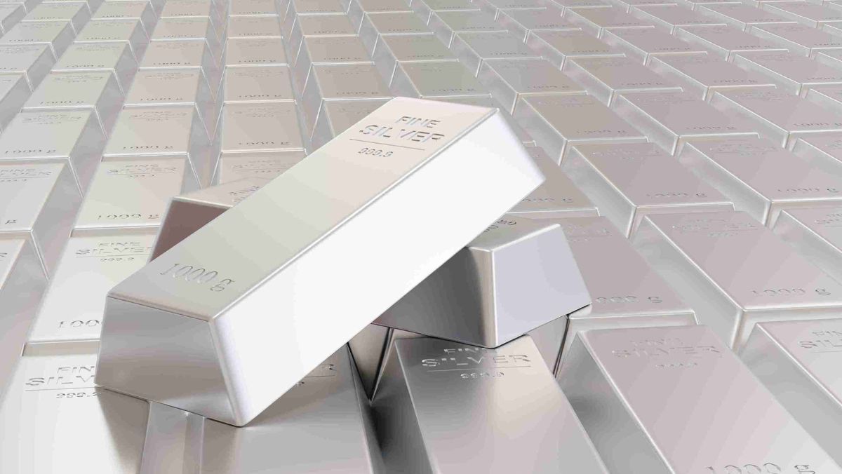 Two unarranged silver bars positioned on top of each other, placed among a set of organized silver bars