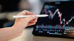 Investor points to the stock market index digital tablet screen to analyze the stock chart for planning investment take profit, trade stock exchange market and cryptocurrency data, financial